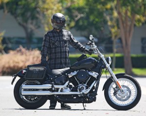 Photo of man standing behind motorcycle with saddlebags installed